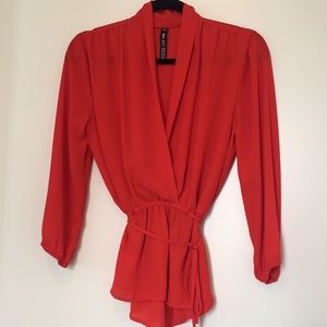 Red blouse with adjustable tie for cinched waist